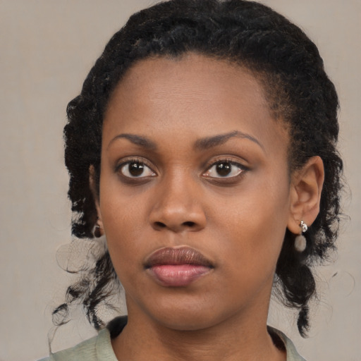 Neutral black young-adult female with medium  black hair and brown eyes