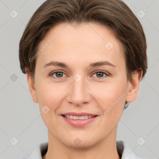 Joyful white young-adult female with short  brown hair and grey eyes