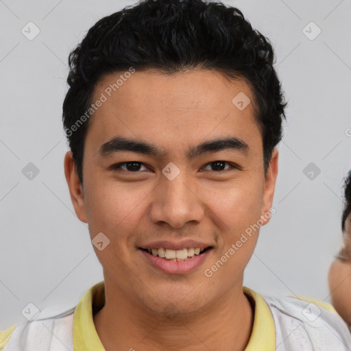 Joyful latino young-adult male with short  brown hair and brown eyes