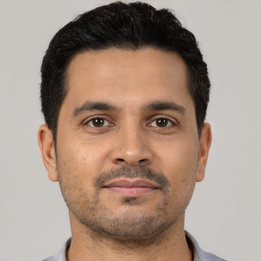 Neutral latino young-adult male with short  black hair and brown eyes