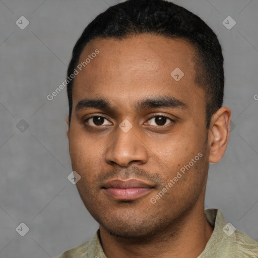 Joyful latino young-adult male with short  black hair and brown eyes