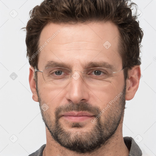 Joyful white adult male with short  brown hair and grey eyes