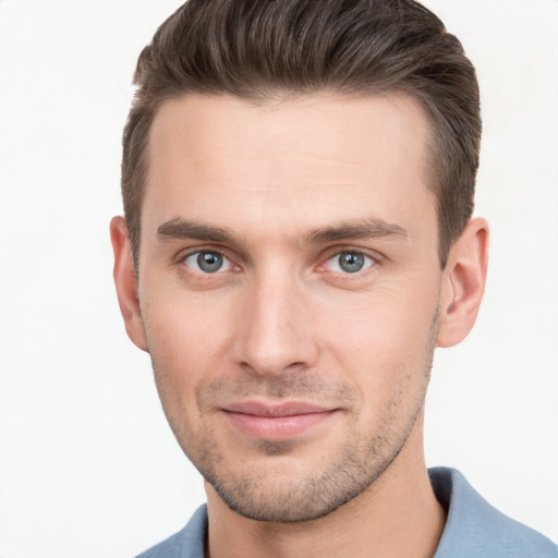 Joyful white young-adult male with short  brown hair and brown eyes