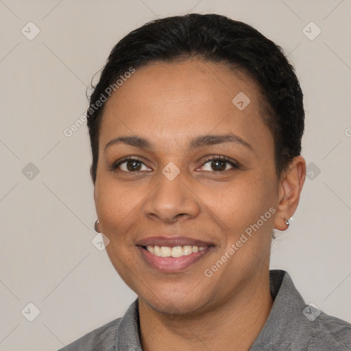 Joyful latino young-adult female with short  black hair and brown eyes