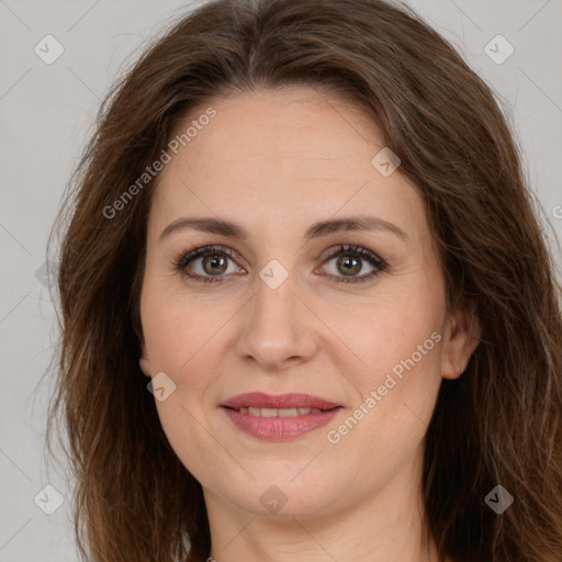 Joyful white adult female with long  brown hair and brown eyes