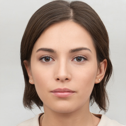 Neutral white young-adult female with medium  brown hair and brown eyes