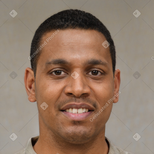 Joyful latino young-adult male with short  black hair and brown eyes