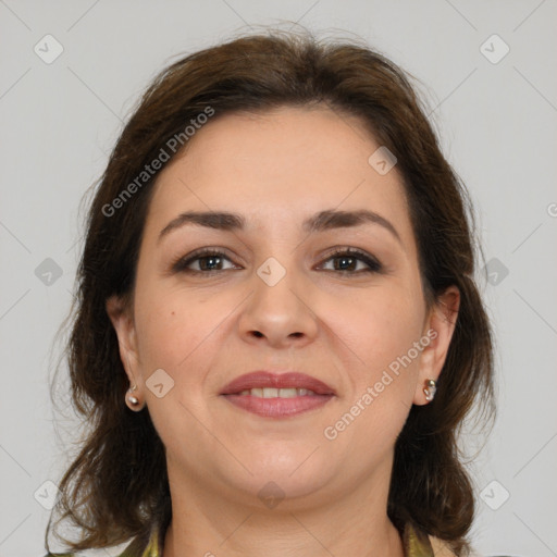 Joyful white adult female with medium  brown hair and brown eyes