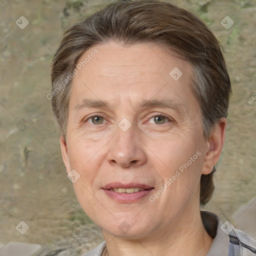 Joyful white adult female with short  brown hair and brown eyes