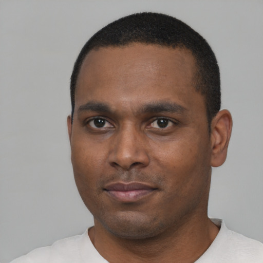 Neutral black young-adult male with short  black hair and brown eyes