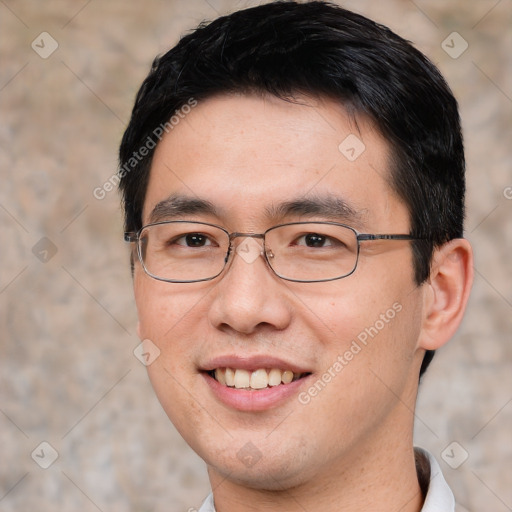 Joyful white young-adult male with short  black hair and brown eyes