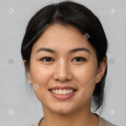 Joyful asian young-adult female with medium  brown hair and brown eyes