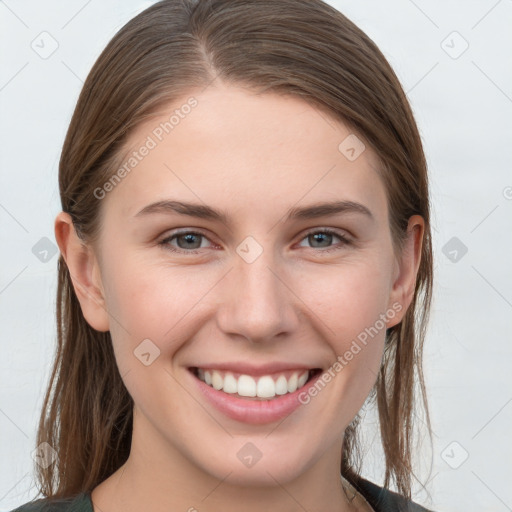 Joyful white young-adult female with long  brown hair and grey eyes