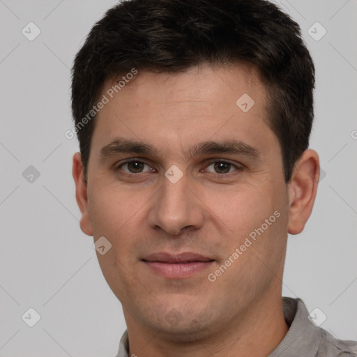 Joyful white young-adult male with short  brown hair and brown eyes