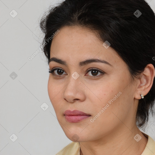 Joyful latino young-adult female with medium  brown hair and brown eyes