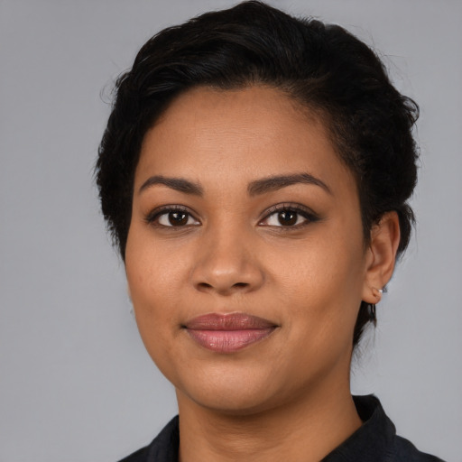 Joyful latino young-adult female with medium  black hair and brown eyes