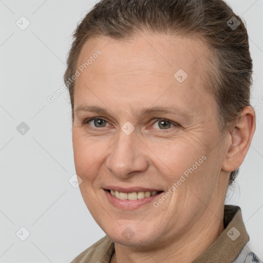 Joyful white adult female with short  brown hair and brown eyes