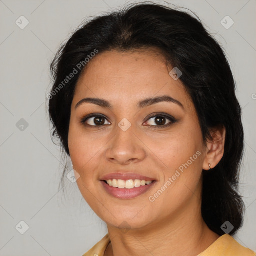 Joyful latino young-adult female with medium  brown hair and brown eyes