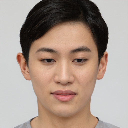 Joyful asian young-adult female with short  black hair and brown eyes