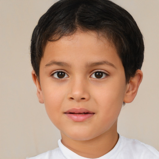 Joyful latino child male with short  brown hair and brown eyes