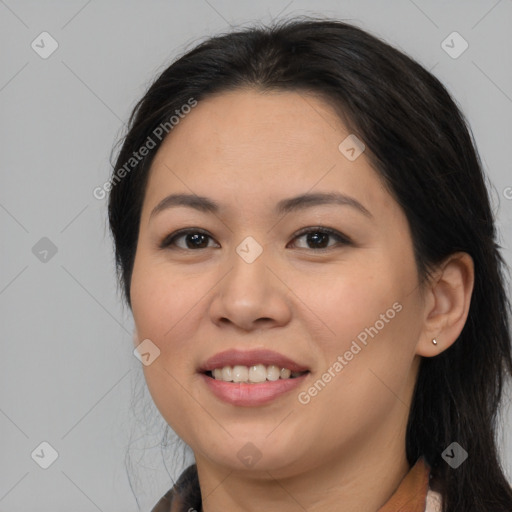 Joyful asian young-adult female with long  brown hair and brown eyes