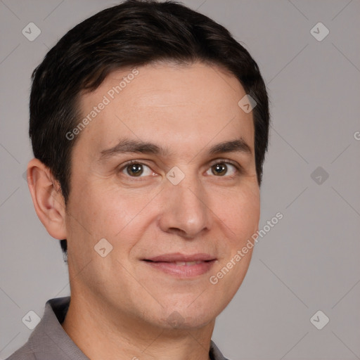 Joyful white adult male with short  brown hair and brown eyes