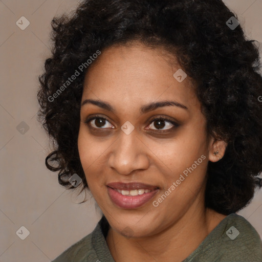 Joyful black young-adult female with long  black hair and brown eyes