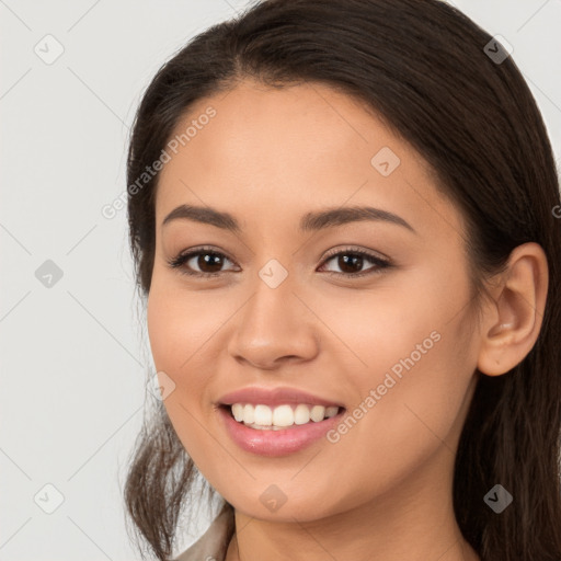 Joyful white young-adult female with long  brown hair and brown eyes