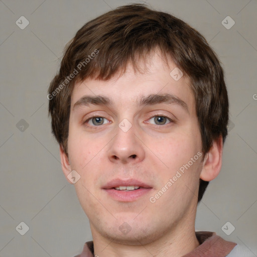 Neutral white young-adult male with short  brown hair and grey eyes