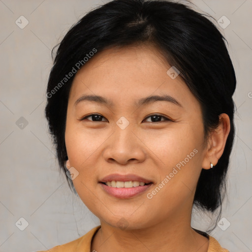 Joyful asian young-adult female with medium  brown hair and brown eyes