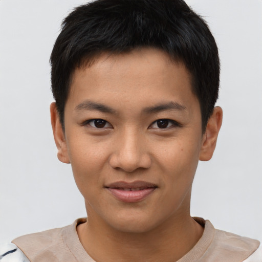 Joyful asian young-adult male with short  black hair and brown eyes