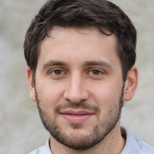 Joyful white young-adult male with short  brown hair and brown eyes