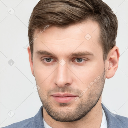 Neutral white young-adult male with short  brown hair and grey eyes