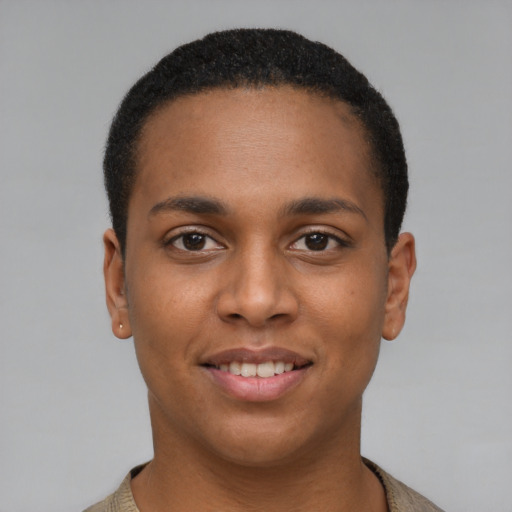 Joyful black young-adult male with short  brown hair and brown eyes