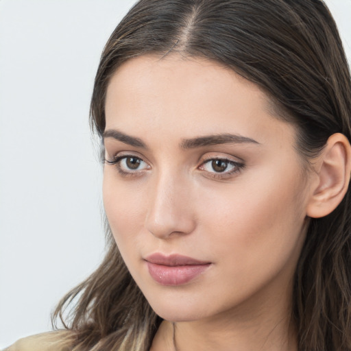 Neutral white young-adult female with long  brown hair and brown eyes