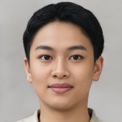 Joyful asian young-adult female with short  black hair and brown eyes