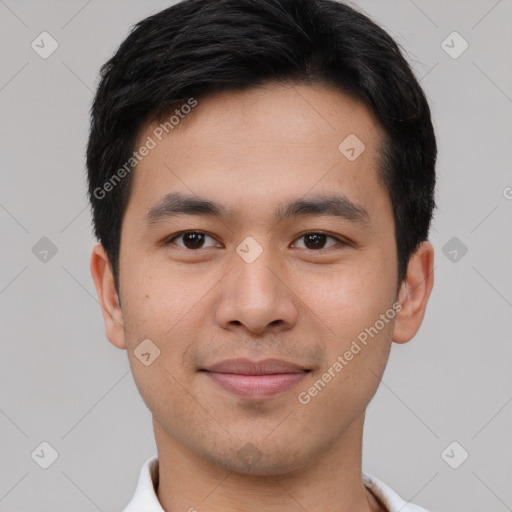 Joyful asian young-adult male with short  brown hair and brown eyes