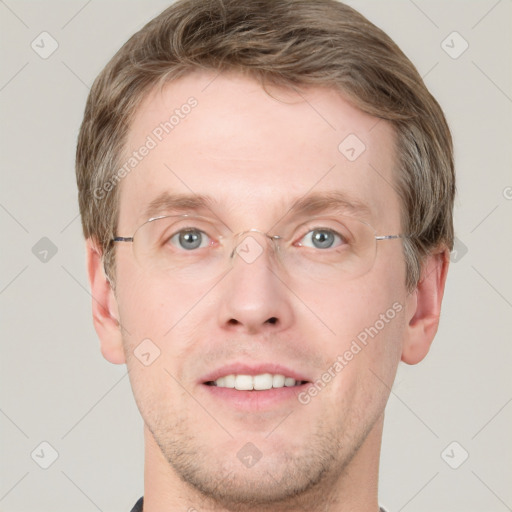 Joyful white adult male with short  brown hair and grey eyes