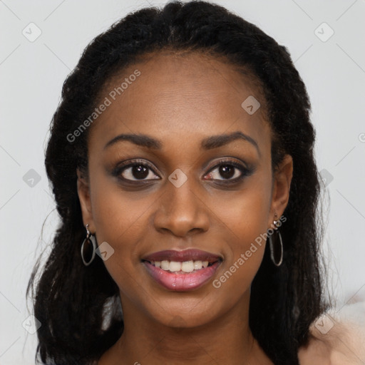 Joyful black young-adult female with long  brown hair and brown eyes