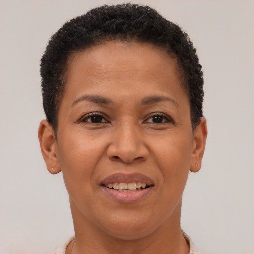 Joyful latino adult female with short  brown hair and brown eyes