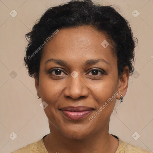 Joyful black adult female with short  brown hair and brown eyes