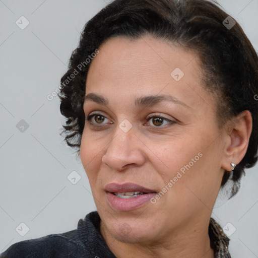 Joyful white adult female with short  brown hair and brown eyes