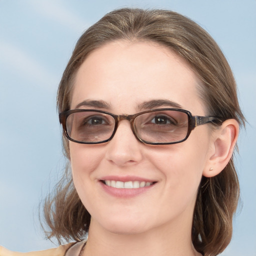 Joyful white young-adult female with medium  brown hair and blue eyes