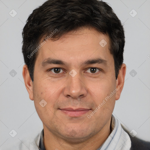 Joyful white adult male with short  brown hair and brown eyes