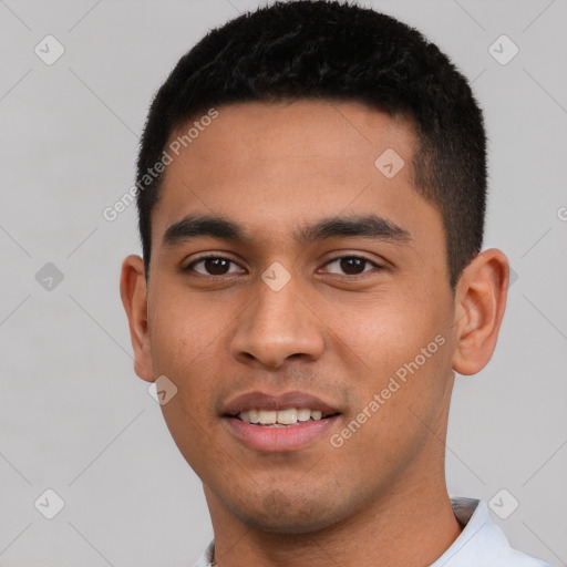 Joyful latino young-adult male with short  black hair and brown eyes