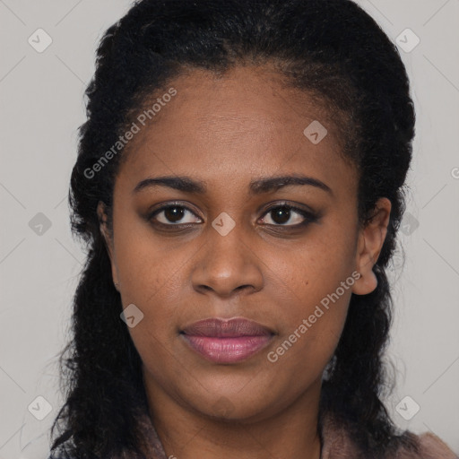 Joyful black young-adult female with long  brown hair and brown eyes