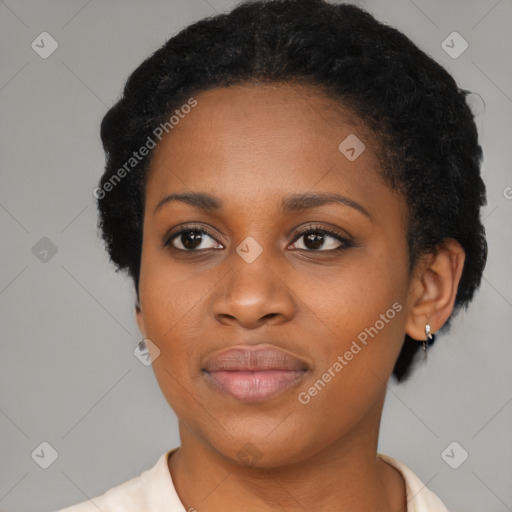 Joyful black young-adult female with short  black hair and brown eyes