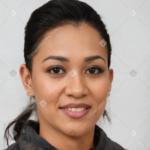 Joyful latino young-adult female with medium  brown hair and brown eyes