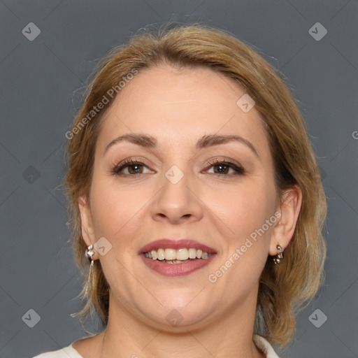 Joyful white adult female with medium  brown hair and brown eyes