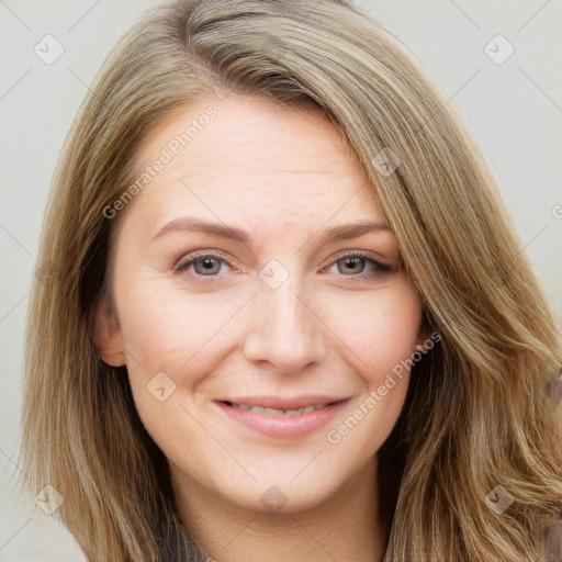 Joyful white adult female with long  brown hair and grey eyes